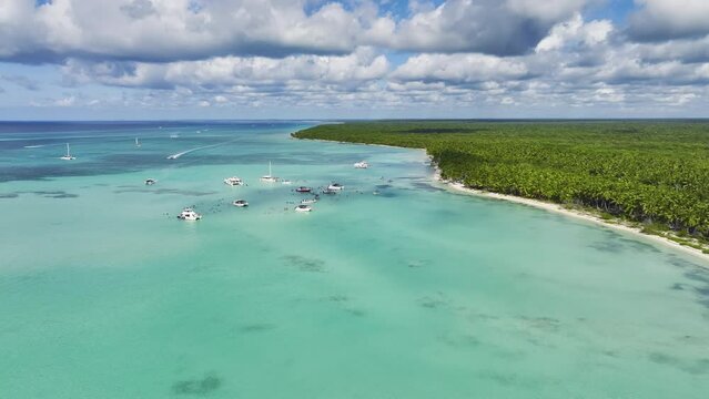 Luxury Boats With People Enjoying On Shallow Waters Of Saona Island ln Dominican Republic. Aerial Drone Shot