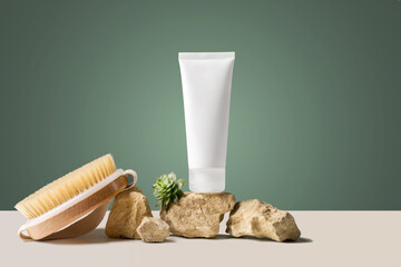 Fragile hands white mockup tube of facial cream with green plant