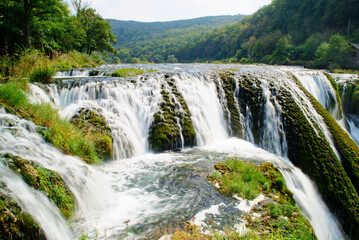 Obraz premium Waterfalls of Una National Park in Bosnia and Herzegovina. A network of river streams, pools, water rapids, canyons and waterfalls.