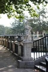 Female marble sculptured statue in the garden in, Madrid, Spain, vertical shot