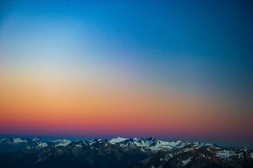 Fototapeta premium Aerial view of a bright sunset sky over Train Glacier, Pemberton, British Columbia, Canada