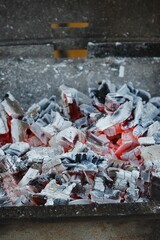 Vertical shot of burning charcoal in a grill stove