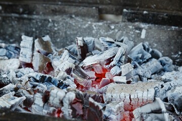 Close-up shot of burning charcoal in a grill stove
