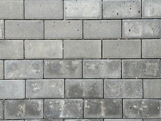 Gray dirty paving stones. Texture of dusty rectangular paving stones