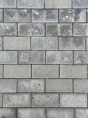 Gray dirty paving stones. Texture of dusty rectangular paving stones