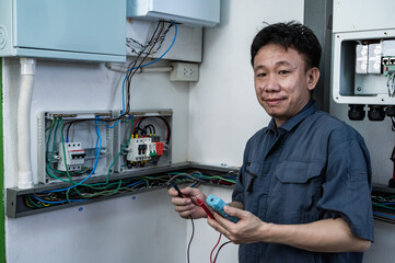 Professional solar engineer installing solar roof combiner box for home use