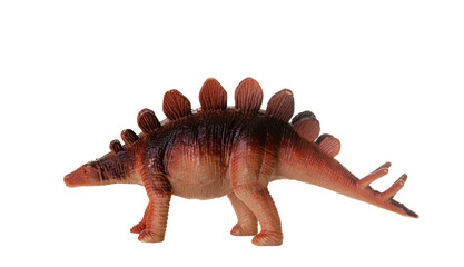 Realistic plastic model of a Stegosaurus dinosaur on white background.