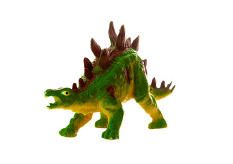 Realistic plastic model of a Stegosaurus dinosaur on white background.