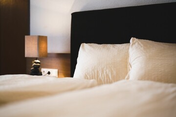 Lamp near a bed in the hotel room