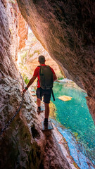 Embarking on an Epic Journey: A Spirited Young Adventurer Explores the Untamed Beauty of Teruel, Tracing the Serpentine Path to the Majestic Origin of River Pitarque.
