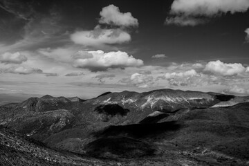 Grayscale shot of mountains against the background of the cloudy sky. Mexico.
