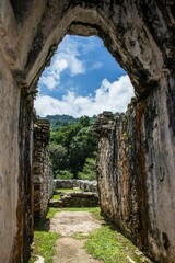 Beautiful landscape seen from a stone tunnel in Palenque on a bright summer day