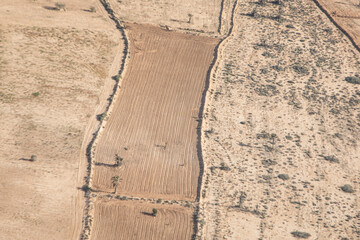 aerial of agricultural landscape in Djerba, Tunesia with dry field