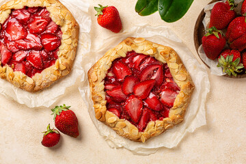 Two Strawberry Galette with almonds.  Homemade  open pie or tart with berries. Top view.