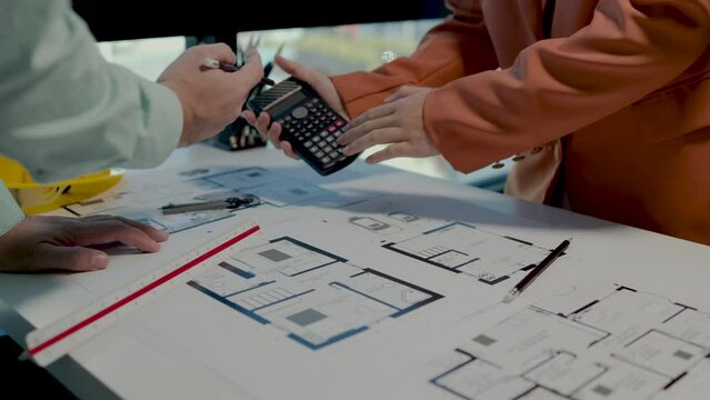 an engineer is trying to plan how to make the client feels satisfy on his design, an architect is putting his ideas into the project based on a sample blueprint the client wants
