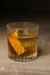 Vertical shot of a cocktail on a wooden background.