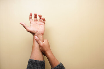 top view of man suffering wrist pain 