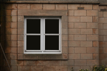 Vintage Window Embedded in Stone Wall of an Ancient House