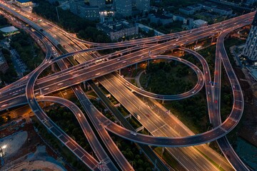 Aerial view of Wuhan Optics Valley Avenue overpass during evening peak hours.