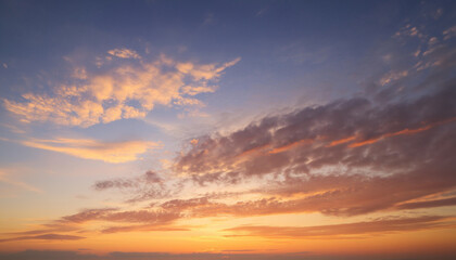 Fototapeta premium Real majestic sunrise sundown sky background with gentle colorful clouds.