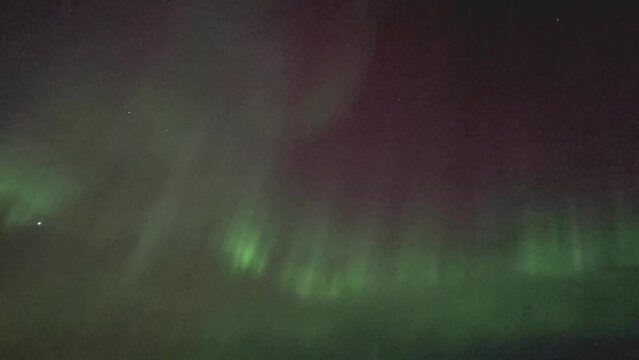 Time lapse of Northern Lights or Aurora Borealis in Iceland near Hofn.  The green Polar Lights dancing waves is a natural Phenomena