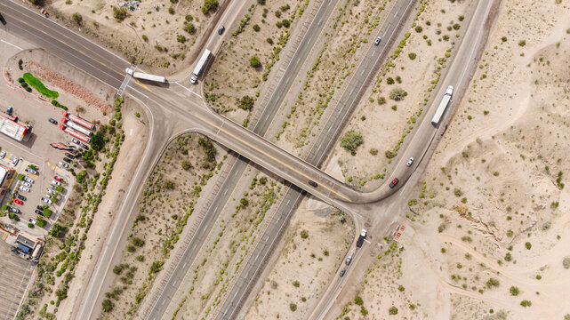 Photo of a landscape of roads with cars in the desert from a height. Drone photo