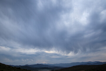 Fototapeta premium Rolling cloudscape over the hills in the Boland region of the Western Cape province in South Africa