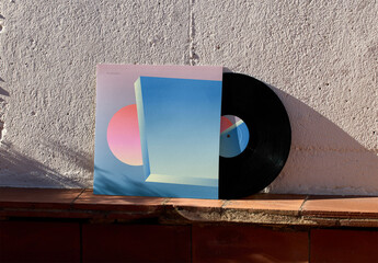 Mockup of customizable LP album by wall in sleeve