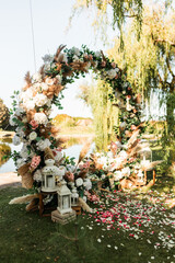 Wedding. Wedding ceremony. Arch. Arch decorated with pink and white flowers in the wedding ceremony area
