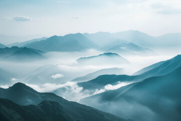Obraz premium A tranquil view of the layers of mountain ridges disappearing into misty clouds, with their soft outlines and muted colors.