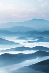 A tranquil view of the layers of mountain ridges disappearing into misty clouds, with their soft outlines and muted colors.
