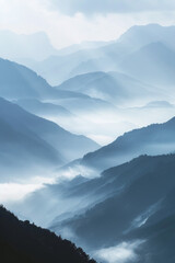 Fototapeta premium A tranquil view of the layers of mountain ridges disappearing into misty clouds, with their soft outlines and muted colors.