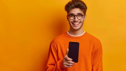Fototapeta premium Smiling Man Presenting Smartphone