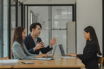 working together in workplace, exchange an idea to each other with a team for more perspective of how to do work well, a group of businesspeople is planning about new project