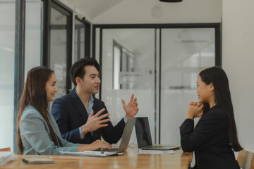 working together in workplace, exchange an idea to each other with a team for more perspective of how to do work well, a group of businesspeople is planning about new project