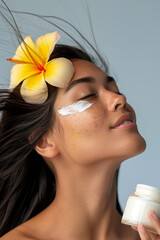 woman with a jar of cream and flower on her head.