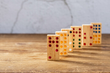 wooden dominoes game on wooden background