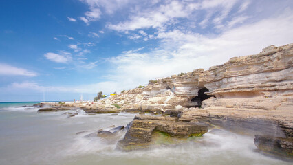 Seascape from the deserted shore to the caspian sea with blue sky and roaring waves timelapse