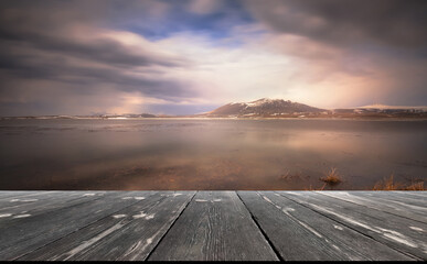 Beautiful Lake with empty wooden table. Natural template landscape
