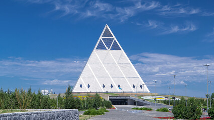 Exterior of the Palace of Peace and Reconciliation building timelapse hyperlapse in Astana,...