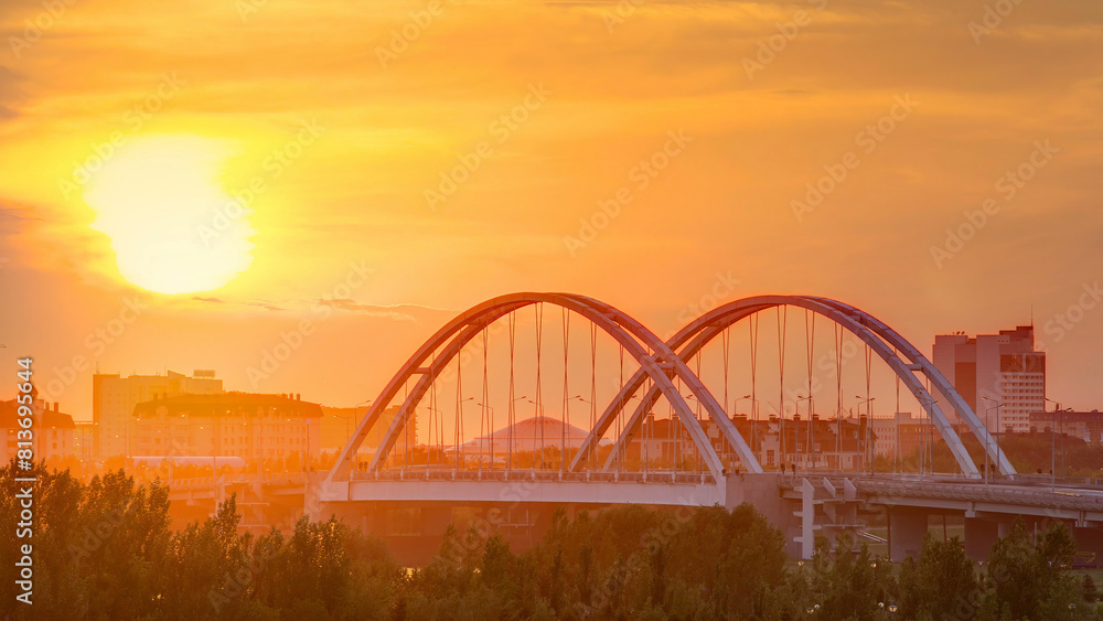 Poster sunset timelapse above the bridge with the transport and clouds on the background. central asia, kaz