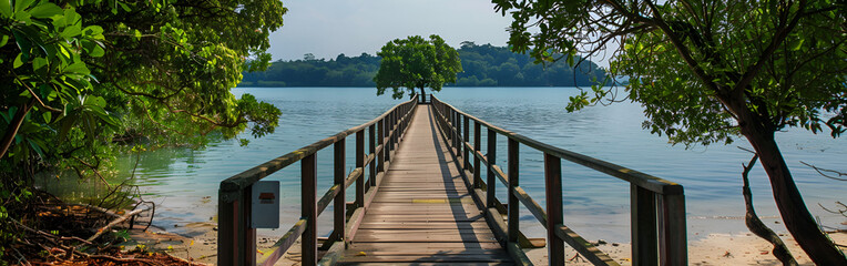 Obraz premium Serene wooden pier extending into calm waters on a sunny day