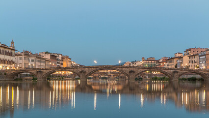 Fototapeta premium Ponte Alla Carraia and Santa Trinita Holy Trinity Bridge day to night timelapse over River Arno in Florence