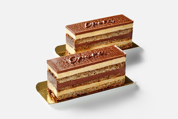 Opera cake slices with walnut sponge, chocolate ganache and buttercream