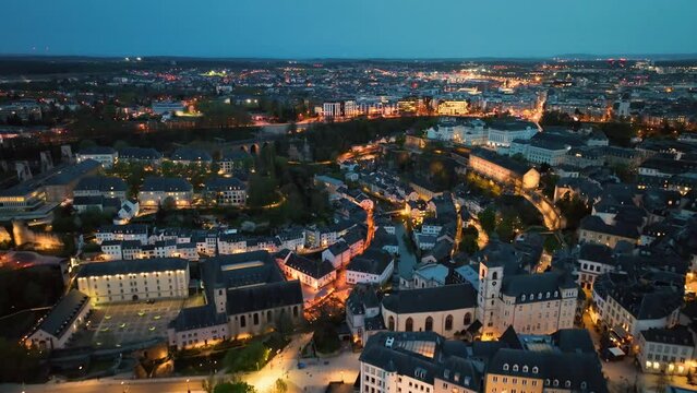 4K Aerial view of a Grand Duchy of Luxembourg , city skyline to night at Grund along Alzette river in the historical old town of Luxembourg