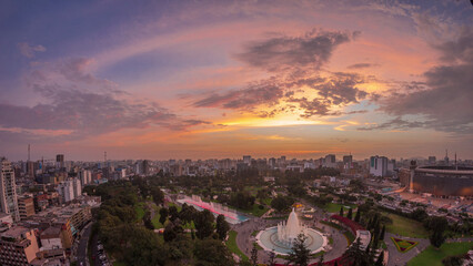 Aerial view to Park of the Reserve with magic water circuit biggest fountain complex day to night timelapse