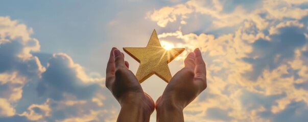 close - up of hands holding golden star against sky with clouds