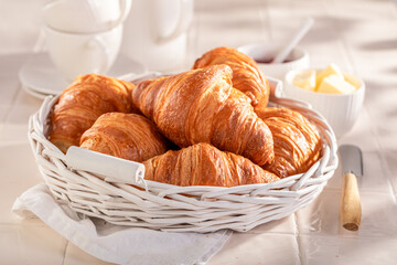 Sweet and healthy french croissants with jam and butter.