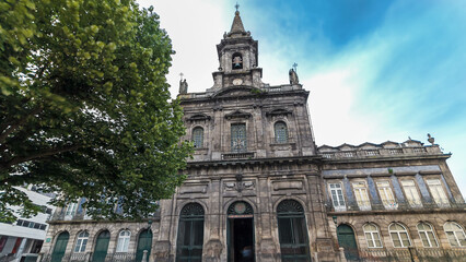Fototapeta premium The Trinity Church timelapse hyperlapse in Porto, Portugal. Porto is one of the most popular tourist destinations in Europe.