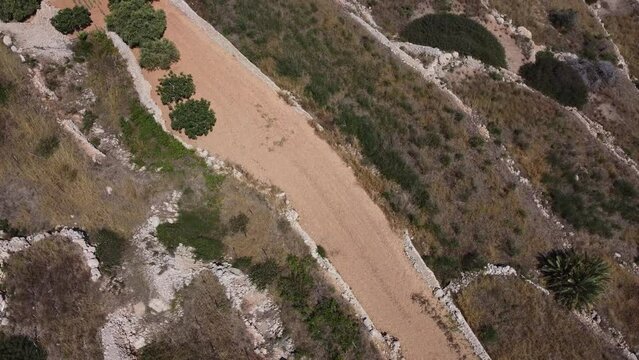 Agricultural fields, terraced land, malta,Aerial view. Revealing Mistra bay, st pauls island, Qawra and Buggiba in the distance, Mediterranean Sea. High quality 4k footage